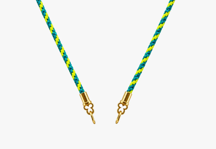 Electric Sour Candy Stripes hand-braided silk cord necklace with solid 14K yellow gold quatrefoil cord ends.
