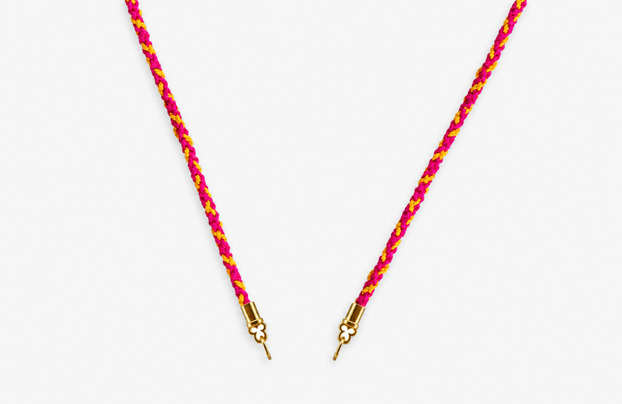 Rock Candy Candy Stripes hand-braided silk cord necklace in pink, fuchsia, and marigold with solid 14K yellow gold quatrefoil cord ends.